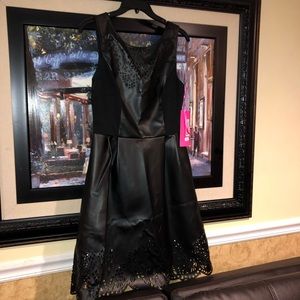 Black faux leather dress with cut out design